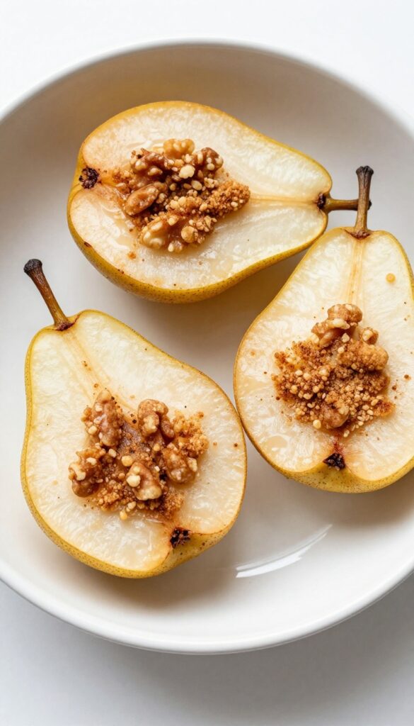 Roasted pears with cinnamon walnut crumble, a Whole30 dessert recipe, in a baking dish under natural light.